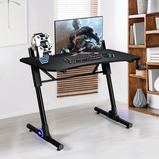 43.5 Inch Height Adjustable Gaming Desk with Blue LED Lights at Set Shop and Smile