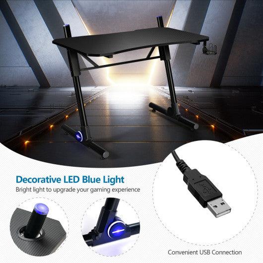 43.5 Inch Height Adjustable Gaming Desk with Blue LED Lights at Set Shop and Smile